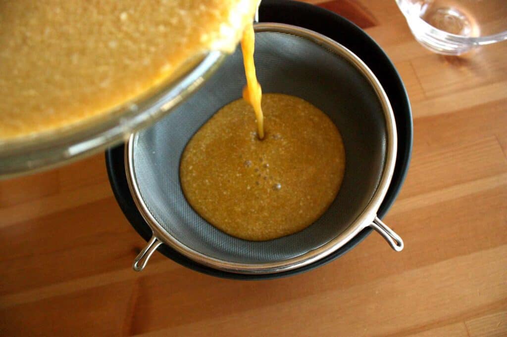 drain the custard mix through a sieve