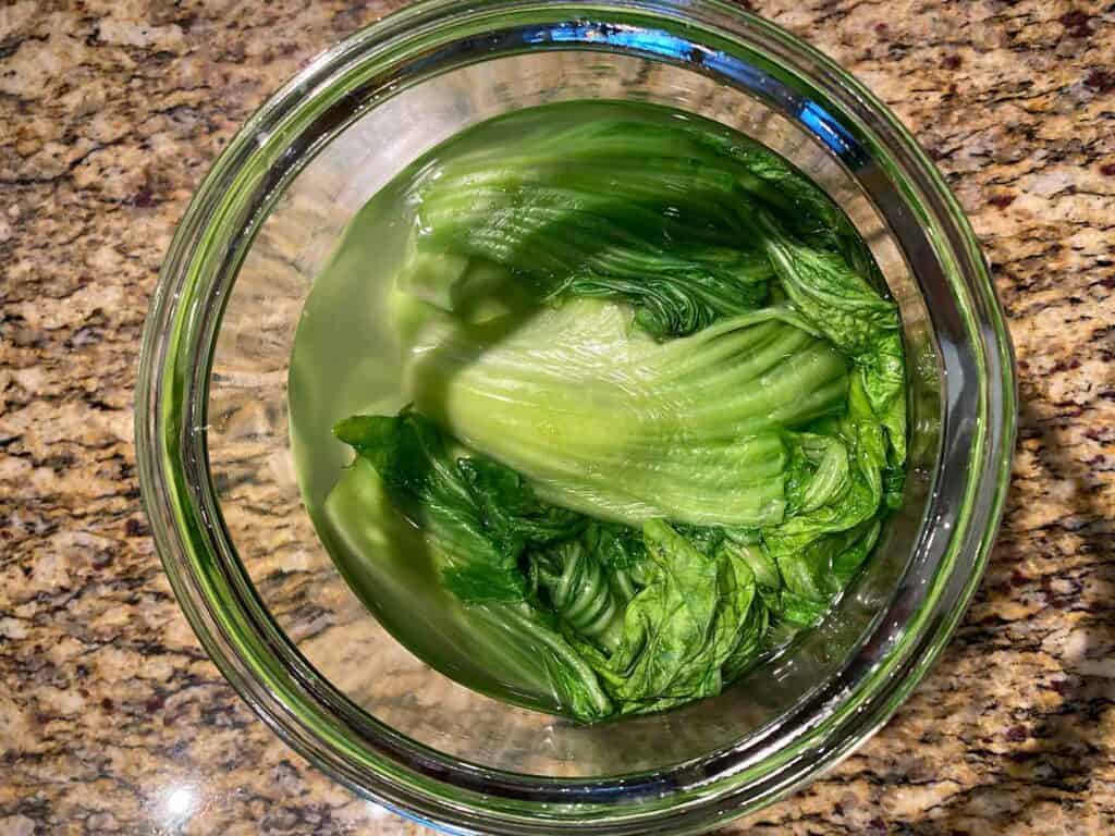 Add brine to the jar with mustard greens