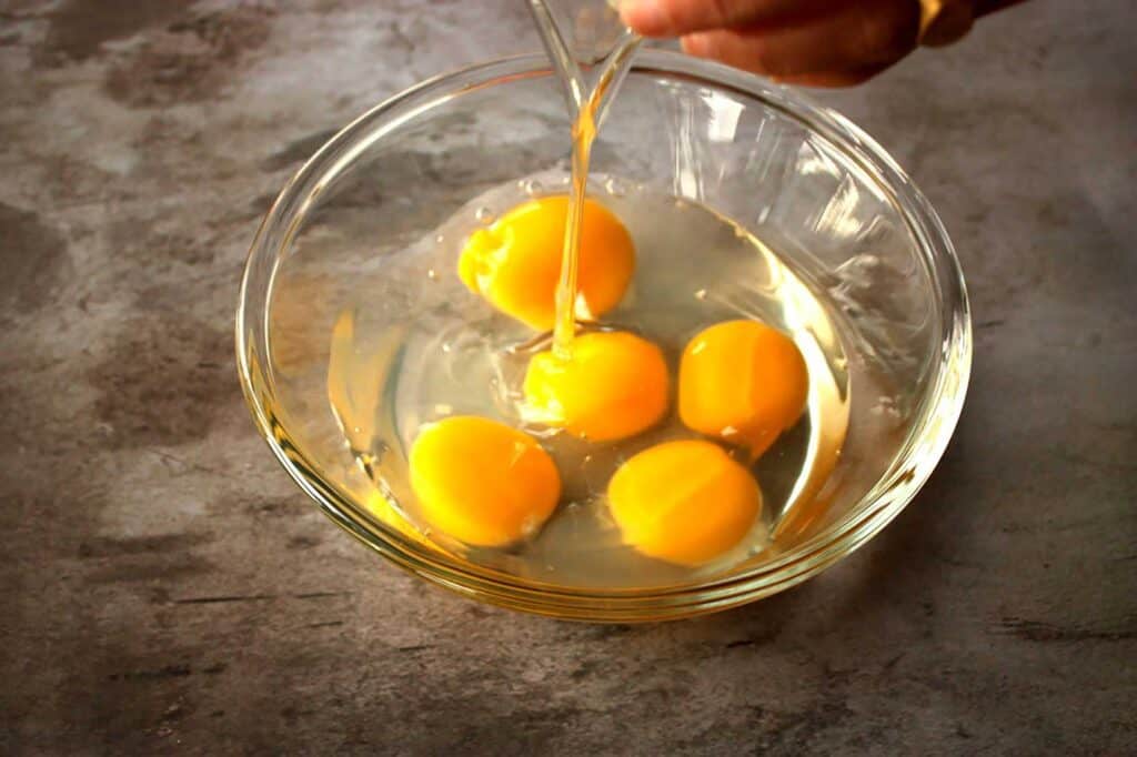 Crack and drain eggs into mixing bowl