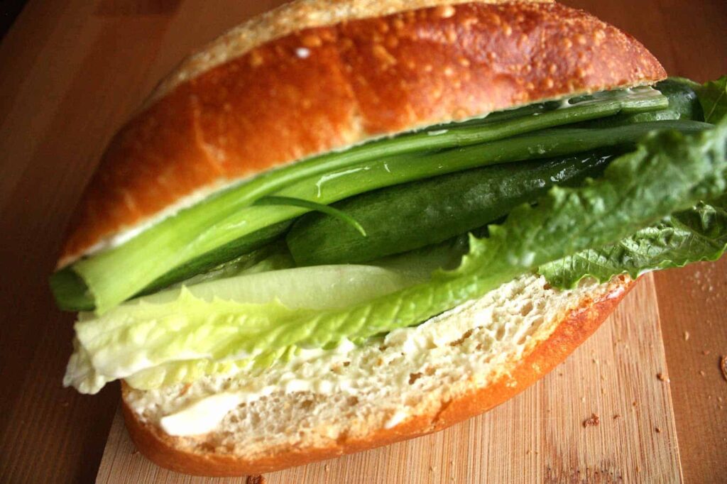 Add lettuce and spring onions to the sandwich